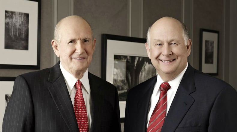 Randall, left, and his brother Gary Rollins, helped grow a family empire of businesses, including Orkin pest control. Randall died August 17.