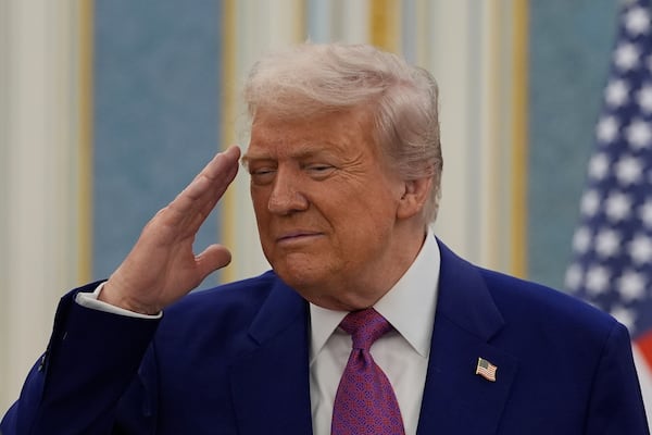 President Donald Trump salutes as he greets with Saudi Crown Prince Mohammed bin Salman delegations at the Royal Palace in Riyadh, Saudi Arabia, Tuesday, May 13, 2025. (AP Photo/Alex Brandon)