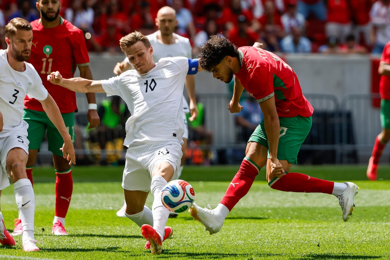 Norway midfielder Martin Odegaard (10) fights for the ball against Morocco forward Abde Ezzalzouli during an international friendly soccer match, Sunday, June 7, 2026, in Harrison, N.J. (AP Photo/Eduardo Munoz Alvarez)