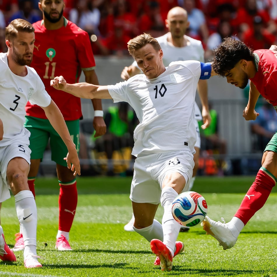 Norway midfielder Martin Odegaard (10) fights for the ball against Morocco forward Abde Ezzalzouli during an international friendly soccer match, Sunday, June 7, 2026, in Harrison, N.J. (AP Photo/Eduardo Munoz Alvarez)