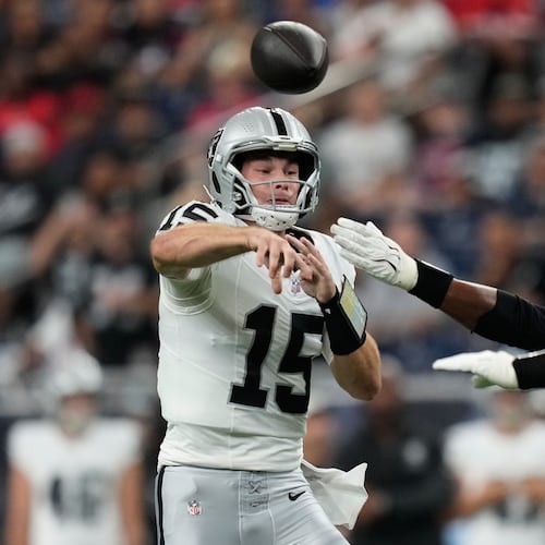 Las Vegas Raiders quarterback Fernando Mendoza (15) throws against the Houston Texans while under pressure during the first half of an NFL preseason football game, Thursday, Aug. 20, 2026, in Houston. (AP Photo/Ashley Landis)