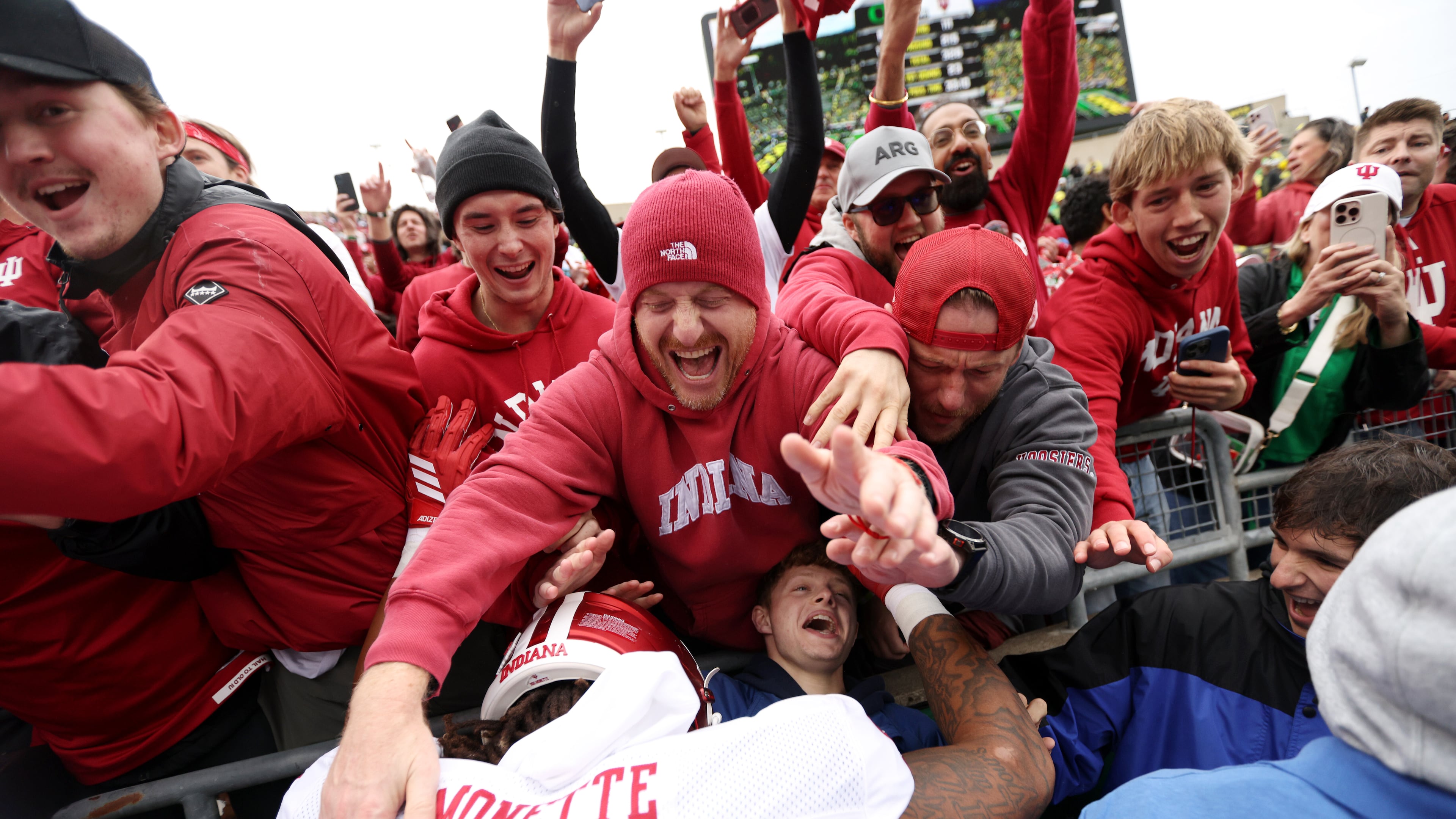 Indiana defensive lineman J'Mari Monnette, bottom,) celebrates after an NCAA college football game against Oregon, Saturday, Oct. 11, 2025, in Eugene, Ore. (AP Photo/Lydia Ely)