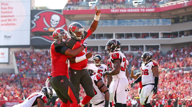 TAMPA, FL - DECEMBER 06: Jameis Winston #3 of the Tampa Bay Buccaneers reacts after scoring a touchdown during the first quarter of the game against the Atlanta Falcons at Raymond James Stadium on December 6, 2015 in Tampa, Florida. (Photo by Rob Foldy/Getty Images)