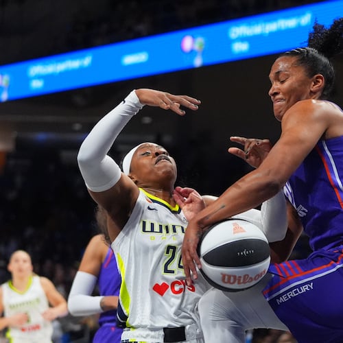 Phoenix Mercury forward Alyssa Thomas (25) strips the ball from Dallas Wings guard Arike Ogunbowale (24) during the first half of a WNBA basketball game in Arlington, Texas, Thursday, June 11, 2026. (AP Photo/LM Otero)