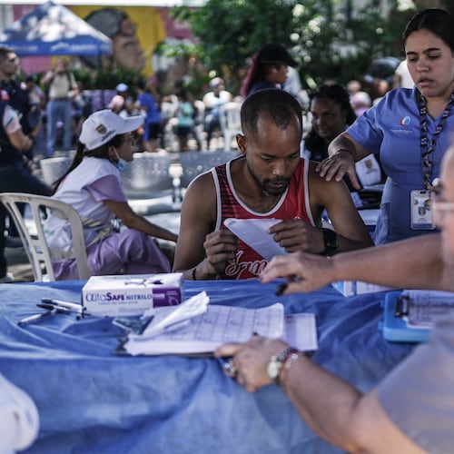 Health workers treat people affected by the earthquake three days after it hit Cali, Colombia, Thursday, Aug. 13, 2026. (AP Photo/Ivan Valencia)
