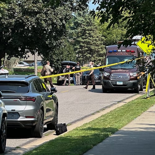 Law enforcement respond to a call at a home daycare, Wednesday, Aug. 12, 2026, in Hopkins, Minn. (AP Photo/Mark Vancleave)