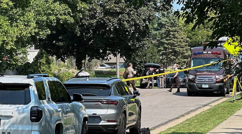 Law enforcement respond to a call at a home daycare, Wednesday, Aug. 12, 2026, in Hopkins, Minn. (AP Photo/Mark Vancleave)