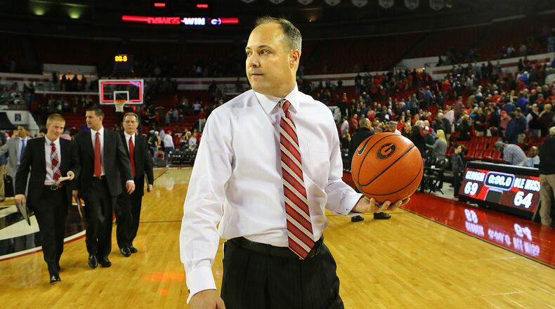 012015 ATHENS: Georgia head coach Mark Fox walks off the court with the basketball after beating Ole Miss 69-64 in a basketball game on Tuesday, Jan. 20, 2015, in Athens. Curtis Compton / ccompton@ajc.com