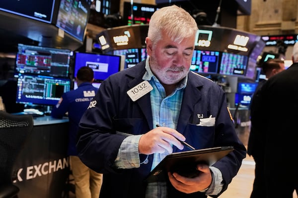 Trader Edward McCarthy works on the floor of the New York Stock Exchange, Tuesday, May 20, 2025. (AP Photo/Richard Drew)