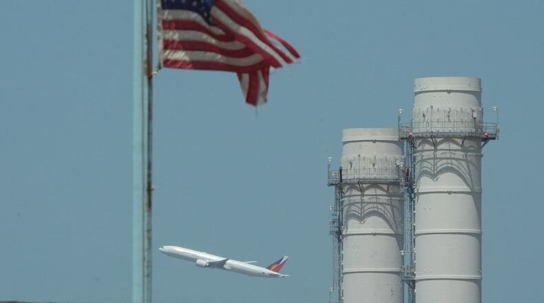 A Philippine Airlines plane takes off from Los Angeles International Airport in El Segundo, Calif., on Friday, April 17, 2026. (AP Photo/Damian Dovarganes)