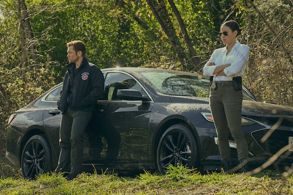 This image released by Apple TV+ shows Taron Egerton, left, and Jurnee Smollett in a scene from "Smoke." (Apple TV+ via AP)