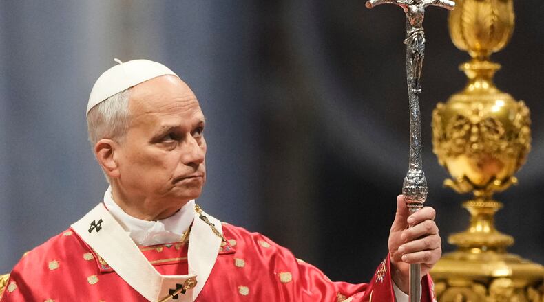 Pope Leo XIV holds the pastoral staff as he celebrates the Pentecost Mass in St. Peter's Basilica, at the Vatican, Sunday, May 24, 2026. (AP Photo/Gregorio Borgia)