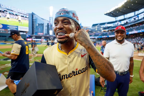 Atlanta rapper Quavo shows off his 2021 World Series championship ring, a gift from Derek Schiller, president & CEO of the Atlanta Braves.
