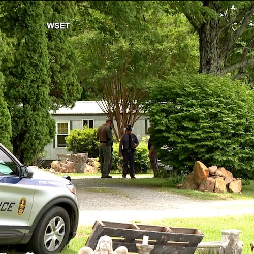 This image taken from video shows law enforcement at the scene of Michael Puckett's home in Carroll County, Va., on Saturday, May 30, 2026. (WSET via AP)