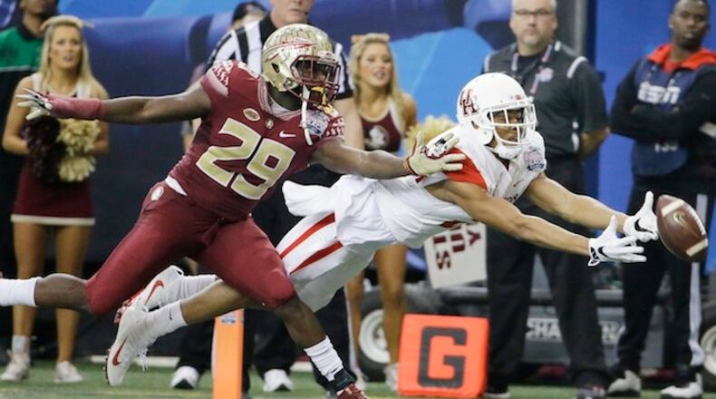 FILE - In this Dec. 15, 2015, file photo, Houston wide receiver Chance Allen (21) reaches for the ball as Florida State defensive back Nate Andrews (29) defends during the second half of the Peach Bowl NCAA college football game in Atlanta. Players on Florida State's secondary believe they have one of the more talented units in the country. (AP Photo/David Goldman, File)