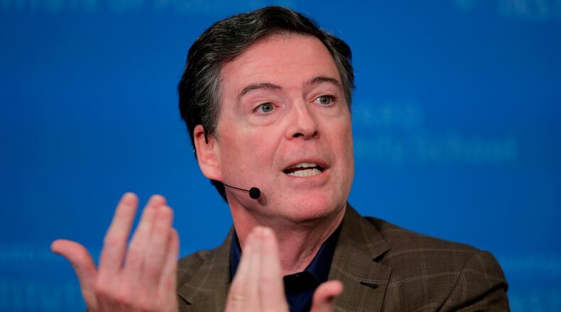 FILE - Former Director of the Federal Bureau of Investigation James Comey at Harvard University's Institute of Politics' JFK Jr. Forum in Cambridge, Mass., Feb. 24, 2020. (AP Photo/Charles Krupa, File)