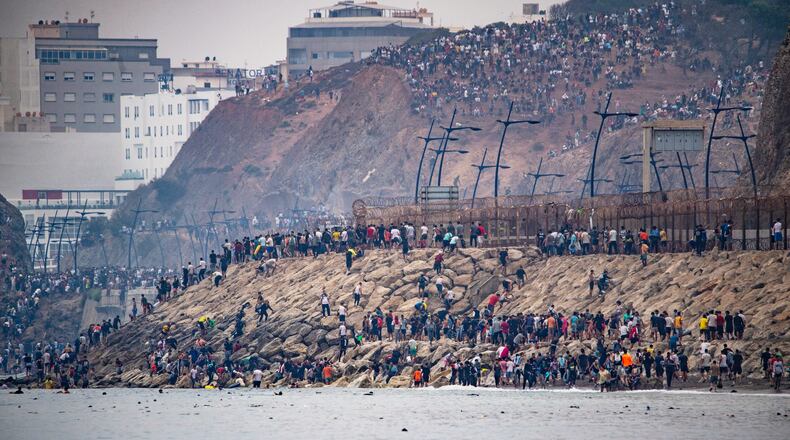 Migrants return to Morocco from the Spanish enclave of Ceuta, Friday, July 31, 2026. (AP Photo/Antonio Sempere)