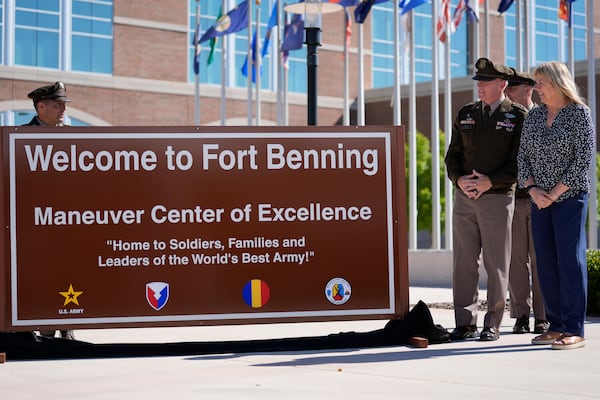 Ms. Sue Conger-Williams, right, Fred Benning's granddaughter unveils a new sign at Fort Benning during a ceremony honoring new namesake on Wednesday, April 16, 2025, in Fort Benning, Ga. (AP Photo/Brynn Anderson)