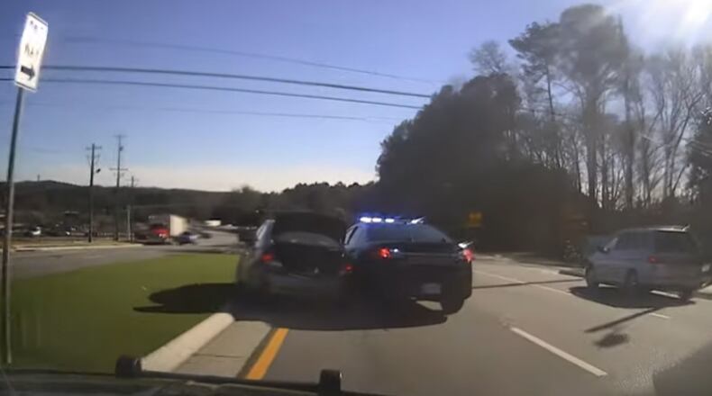 Cobb County police arrested two people after chasing down a car reported stolen in Nashville, Tennessee. The vehicle was owned by a man found dead inside a Nashville motel room on Jan. 9. One of the passengers in the car admitted to shooting the owner in the head, according to investigators. (Credit: Cobb County Police Department)