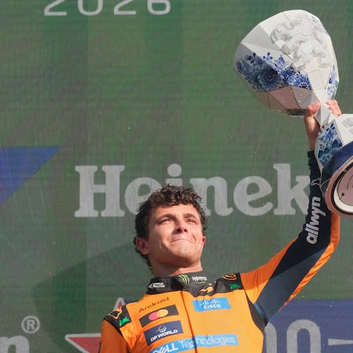 McLaren driver Lando Norris of Britain holds the trophy after winning the Formula One Dutch Grand Prix in Zandvoort , Netherlands, Sunday, Aug. 23, 2026. (AP Photo/Patrick Post)
