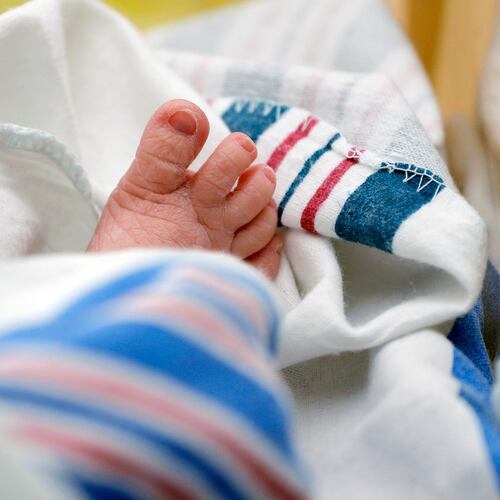FILE - The toes of a baby peek out of a blanket at a hospital in McAllen, Texas, July, 29, 2020. (AP Photo/Eric Gay, File)