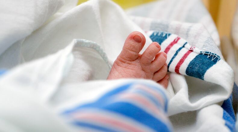 FILE - The toes of a baby peek out of a blanket at a hospital in McAllen, Texas, July, 29, 2020. (AP Photo/Eric Gay, File)