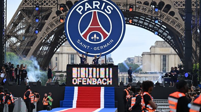Artists perform ahead of PSG's celebrations the day after winning the Champions League title, at the Eiffel Tower, in Paris, Sunday, May 31, 2026. (AP Photo/Emma Da Silva)