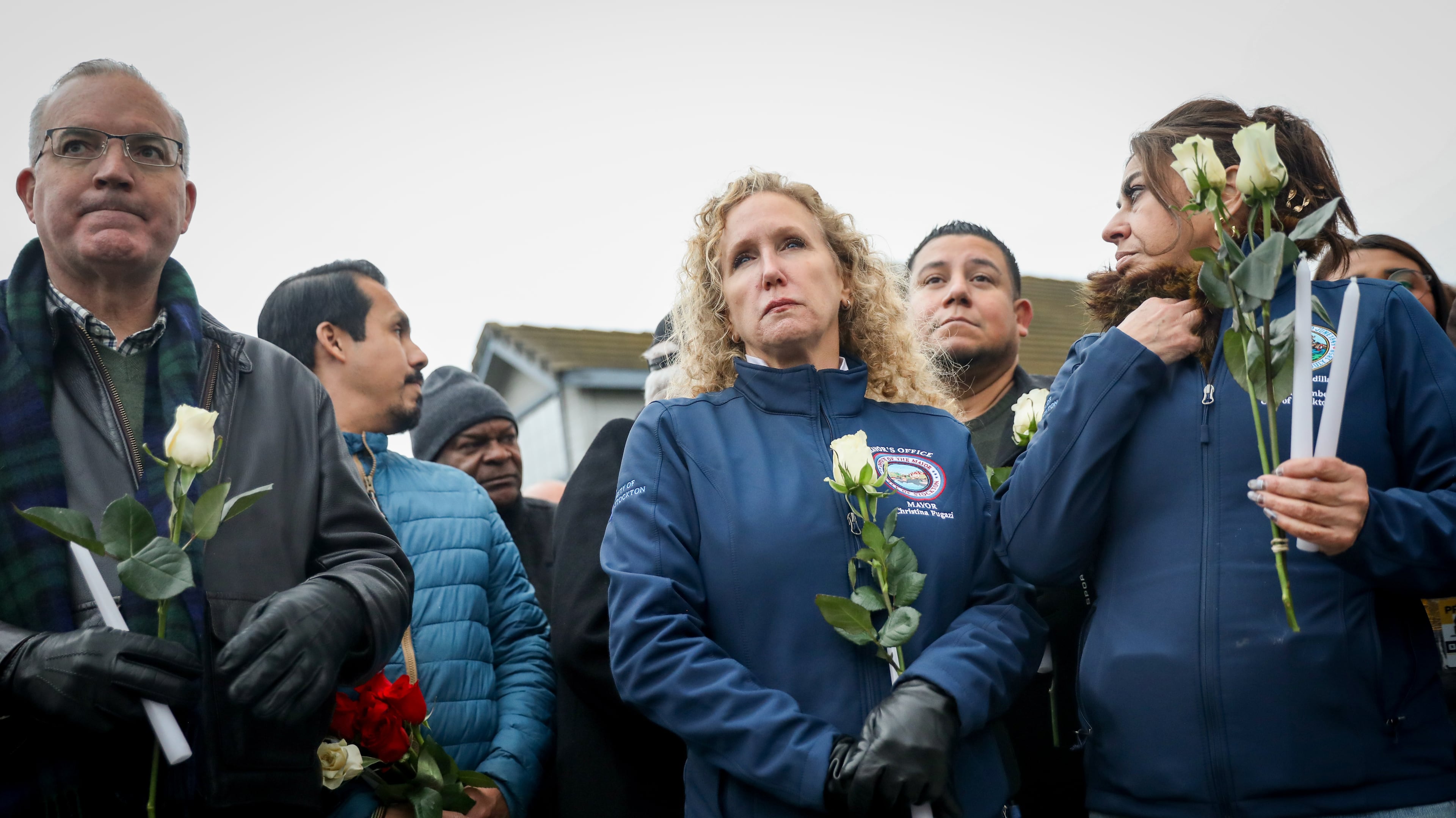 Stockton Mayor Christina Fugazi joins a vigil near the site at Thornton Blvd. and Lucile Ave., where a mass shooting took place Saturday at a banquet hall in Stockton, Calif., Sunday, Nov. 30, 2025. (Brontë Wittpenn/San Francisco Chronicle via AP)