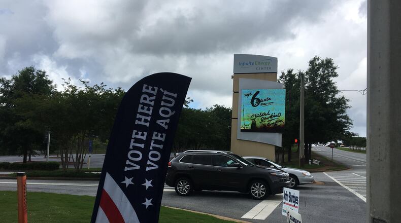 Voters cast ballots at the Infinite Energy Center in Duluth on May 22.