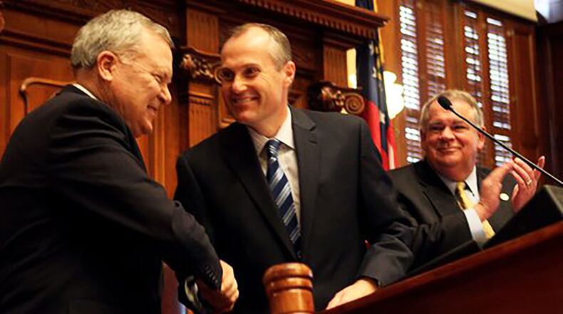 Gov. Nathan Deal (from left) is welcomed to the podium by Lt. Gov. Casey Cagle and House Speaker David Ralston. Staff / 2011 photo