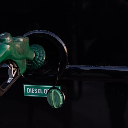 FILE - A nozzle pumps diesel into the fuel tank of bus in Orange, Calif., Tuesday, April 7, 2026. (AP Photo/Jae C. Hong, File)