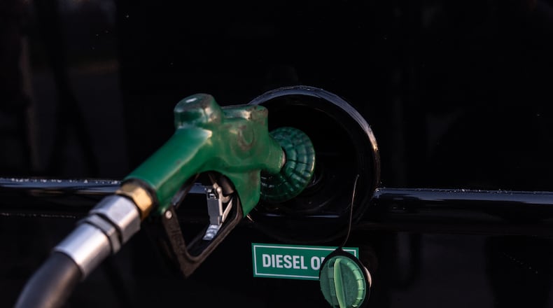 FILE - A nozzle pumps diesel into the fuel tank of bus in Orange, Calif., Tuesday, April 7, 2026. (AP Photo/Jae C. Hong, File)