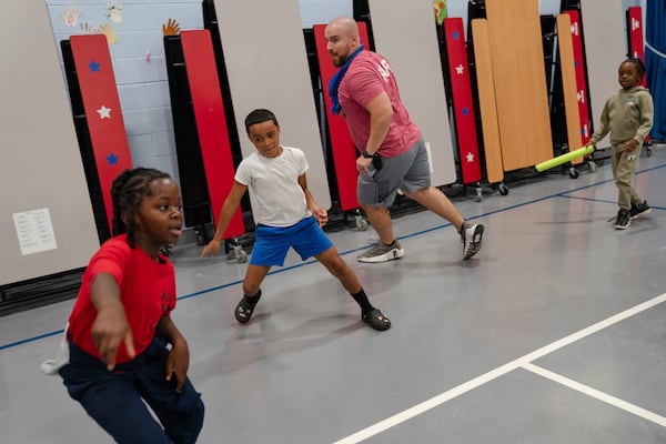 Children play tag during the East Providence Boys and Girls Club Summer Camp at Emma G. Whiteknact Elementary School on Thursday, July 10, 2025, in Providence, R.I. (AP Photo/Sophie Park)