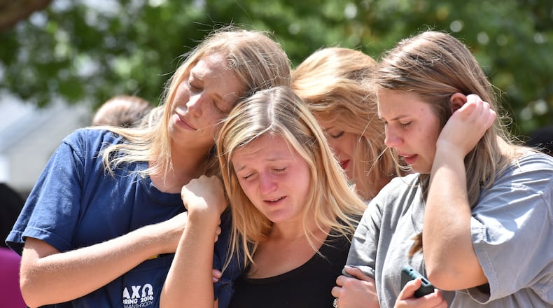 EMOTIONS SPILL OVER--April 28, 2016 Athens - Students gather to mourn the deaths of fellow UGA students at a memorial organized by The Field at Tate Plaza on campus on Thursday, April 28, 2016. Just days before the end of the school year, tragedy struck the University of Georgia community. A two-vehicle crash Wednesday night killed four students and left a fifth in critical condition. HYOSUB SHIN / HSHIN@AJC.COM