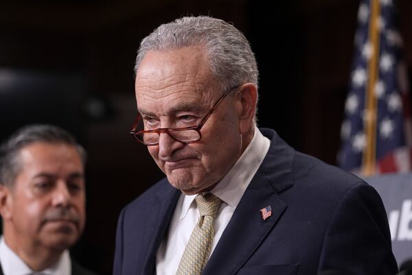 Senate Minority Leader Chuck Schumer, D-N.Y., joined at left by Sen. Ben Ray Lujan, D-N.M., speaks to reporters before the start of a voting marathon as Senate Republicans push the next step to pass President Donald Trump's budget agenda, at the Capitol, in Washington, Friday, April 4, 2025. (AP Photo/J. Scott Applewhite)