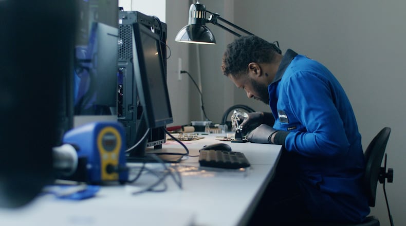 Craig Green, chief technology officer for Carbice, working in Atlanta lab. The company is hiring engineers.