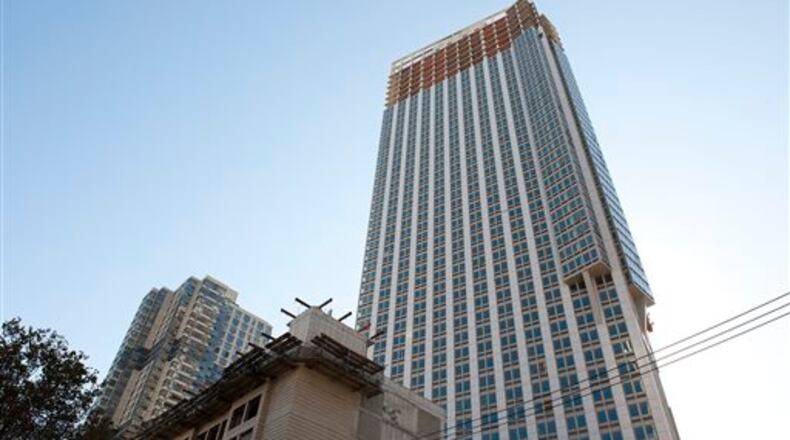 This photo shows a construction site in Jersey City, N.J., where a man delivering sheet rock at the site was killed when a tape measure fell 50 stories and struck him in the head Monday, Nov. 3, 2014. Officials say two 50-story residential towers and an attached hotel are being built at the site of the accident.
