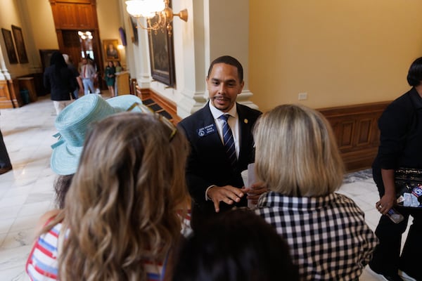 State Sen. Jaha Howard, D-Smyrna, speaks with activists during Day 3 of the special session inside the state Capitol building on Saturday, June 20, 2026, in Atlanta. (Estela Muñoz/AJC)