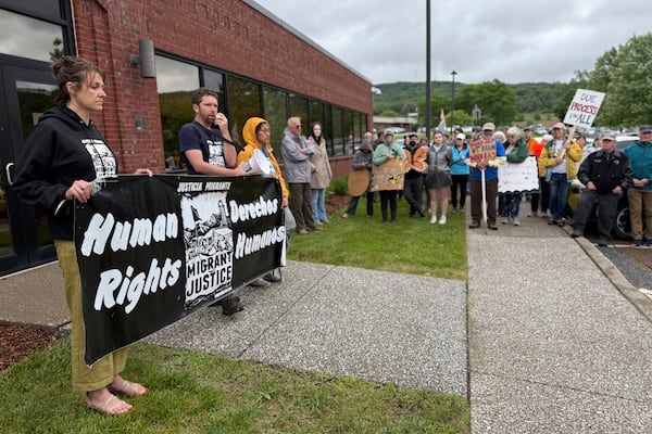 Protesters hold a rally outside a U.S. Immigration and Customs Enforcement office in St. Albans, Vt., on Friday, June 20, 2025, in support of Wuendy Bernardo, a migrant dairy farmworker at risk of deportation. (AP Photo/Amanda Swinhart)