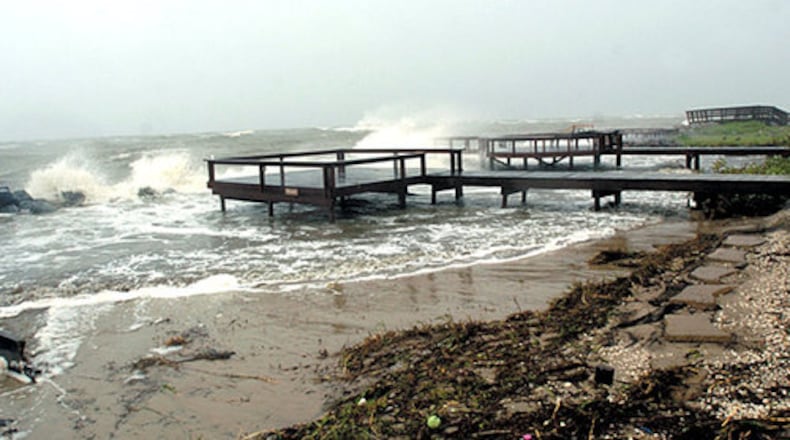 Waves crash over the rocks near St. Simons Island's Cedar Street beach access Friday. The Georgia Department of Natural Resources said numerous loggerhead turtle nests were washed away by the flooding.
