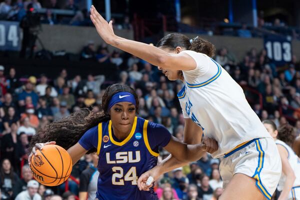 LSU forward Aneesah Morrow (24) goes to the basket as UCLA center Lauren Betts defends during the second half in the Elite Eight of the NCAA college basketball tournament Sunday, March 30, 2025, in Spokane, Wash. (AP Photo/Jenny Kane)