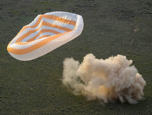 The Soyuz MS-26 spacecraft lands in a remote area near the town of Zhezkazgan, Kazakhstan, with NASA astronaut Don Pettit and Roscosmos cosmonauts Alexey Ovchinin and Ivan Vagner aboard, Sunday, April 20, 2025. (Bill Ingalls/NASA via AP)
