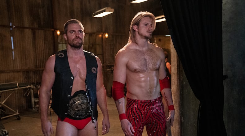 Stephen Amell and Alexander Ludwig plays brothers who run a local Georgia wrestling league in Starz's "Heels." STARZ