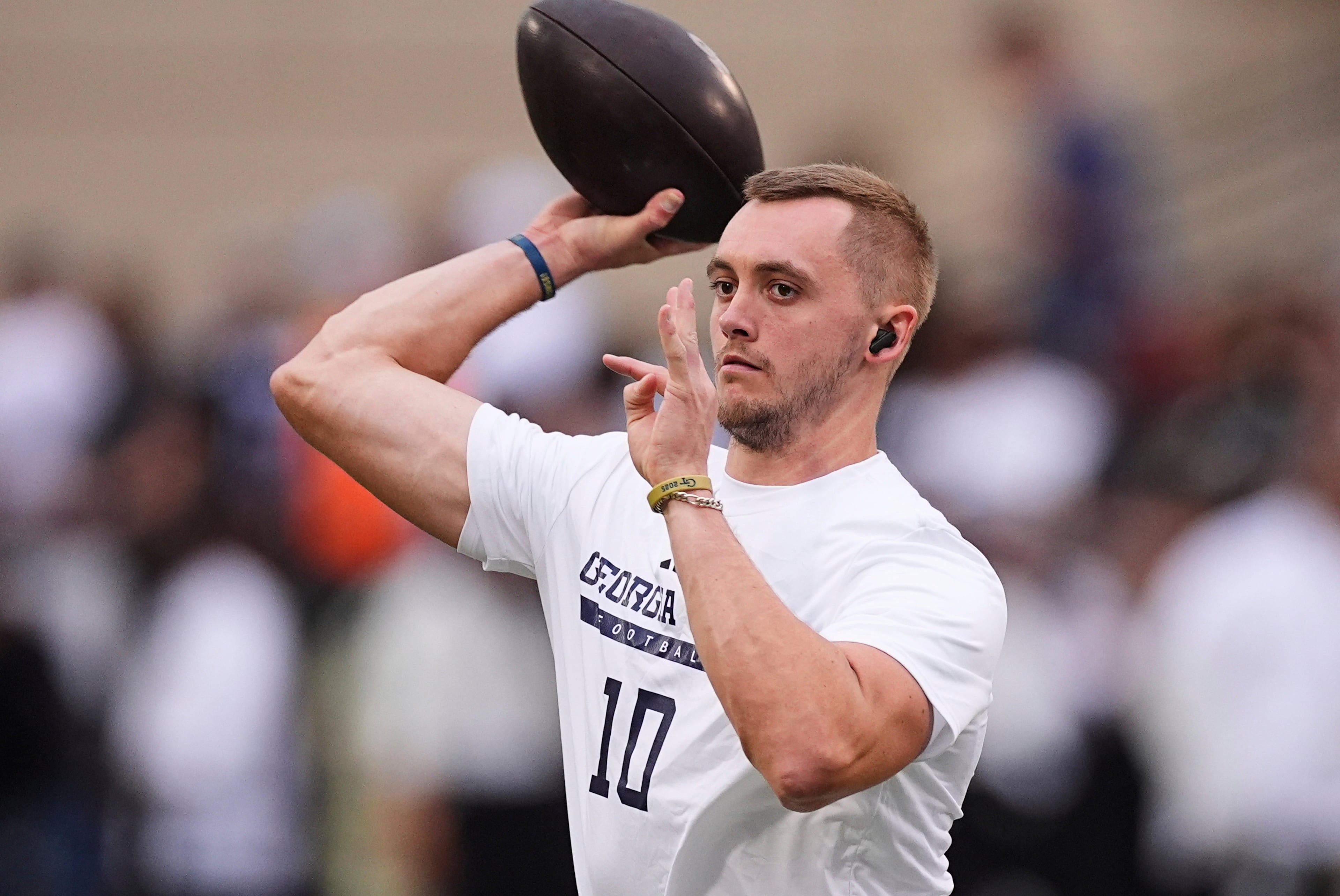 Georgia Tech quarterback Haynes King warms up before an NCAA college football game against Colorado, Friday, Aug. 29, 2025, in Boulder, Colo. (AP Photo/David Zalubowski)