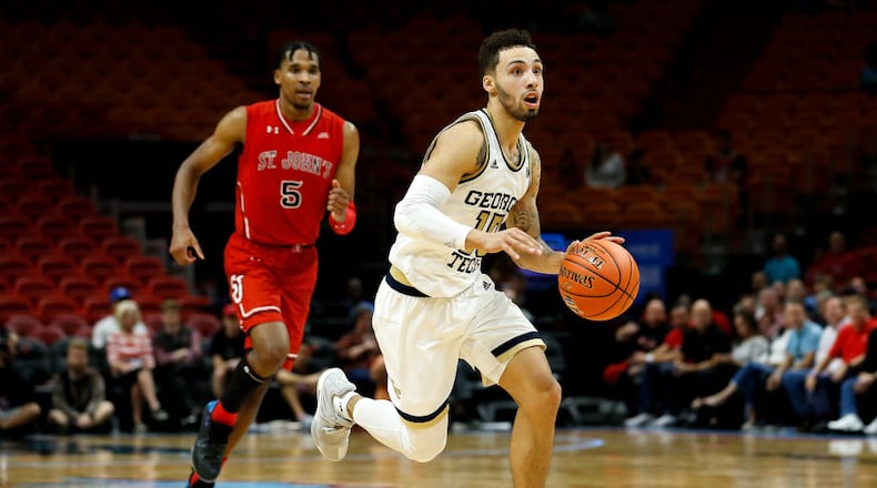 MIAMI, FL - DECEMBER 01: Jose Alvarado #10 of the Georgia Tech Yellow Jackets drives to the basket against Justin Simon #5 of the St. John's Red Storm during the HoopHall Miami Invitational at American Airlines Arena on December 1, 2018 in Miami, Florida. (Photo by Michael Reaves/Getty Images)