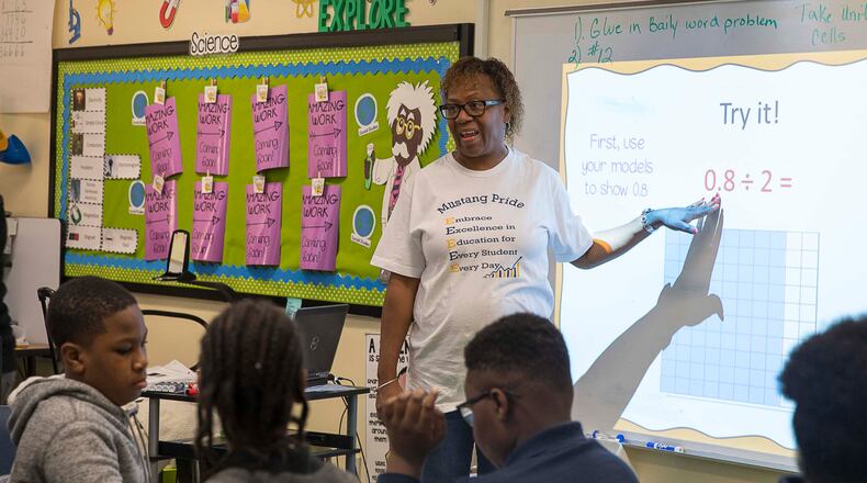 Fifth-grade teacher Chandra Lewis conducts a math lesson for her students at Cliftondale Elementary School in College Park. (Alyssa Pointer/Atlanta Journal Constitution)