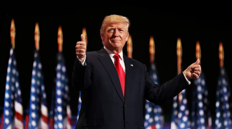 Republican presidential candidate Donald Trump gives the thumbs-up sign at the Republican National Convention in Cleveland last July.