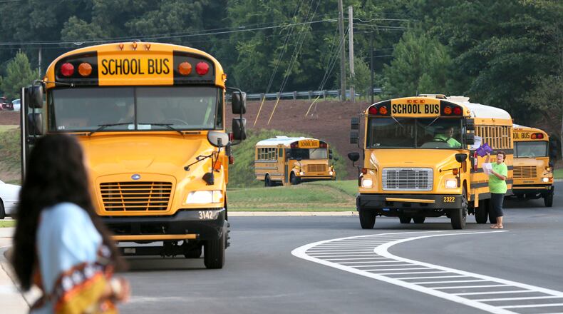 Cherokee County School District officials are encouraging parents in the River Ridge attendance area to have their children ride buses to school because of road construction in the vicinity. AJC FILE