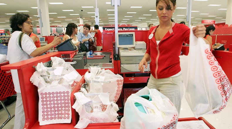 FILE PHOTO: A Target cashier rings up customers at a Target store.