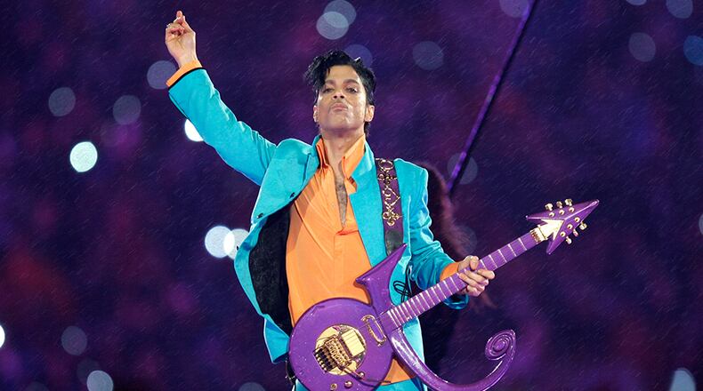 FILE - In this Feb. 4, 2007 file photo, Prince performs during the halftime show at the Super Bowl XLI football game at Dolphin Stadium in Miami. Prince, widely acclaimed as one of the most inventive and influential musicians of his era with hits including "Little Red Corvette," ''Let's Go Crazy" and "When Doves Cry," was found dead at his home on Thursday, April 21, 2016, in suburban Minneapolis, according to his publicist. He was 57. (AP Photo/Chris O'Meara, File)